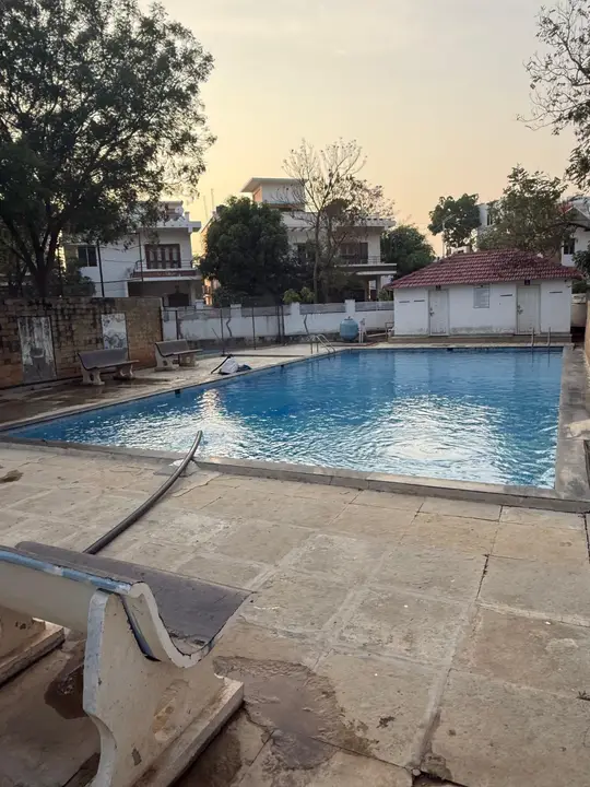 The pool and villas behind it